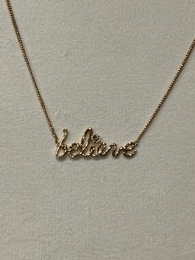 Disney Couture Gold-tone 'Believe' Script Necklace with Clear Stone